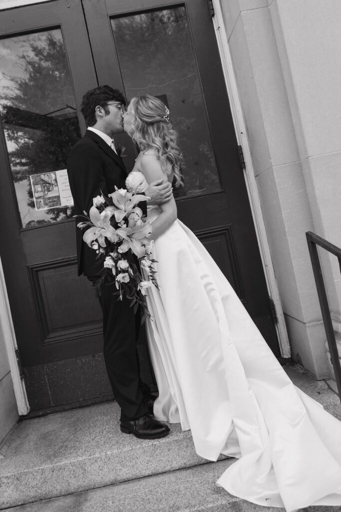 A romantic kiss between a bride and groom taken by a Louisville, Ky documentary wedding photographer.