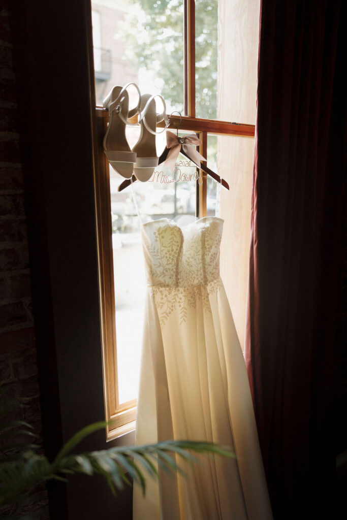 Wedding details taken in front of a window at Bespoke in Bond in Bardstown, Ky.