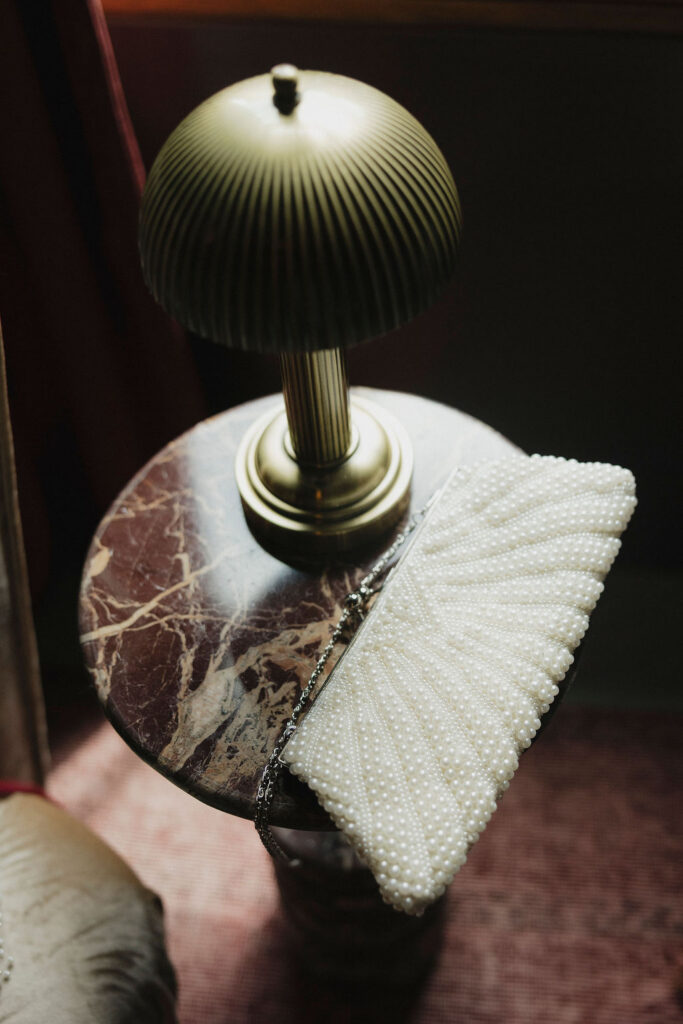 A bride's clutch details taken in a documentary approach. 