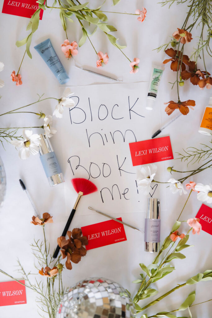 Louisville branding photographer | a piece of paper that says 'block him book me!' surrounded by an estheticians business cards and products.