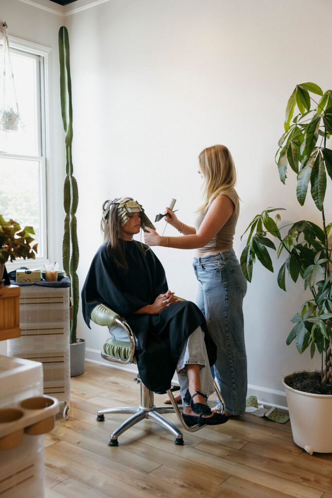 Small business owner working at Atomic House of Hair in Louisville.
