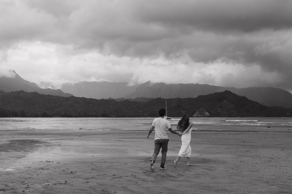 Couple having fun during their Hanalei Bay engagement photos