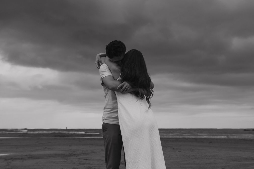 Intimate couple’s portrait on the sand at Hanalei Bay