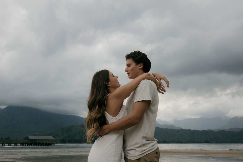 Documentary-style engagement photograph captured on the coast of Kauai