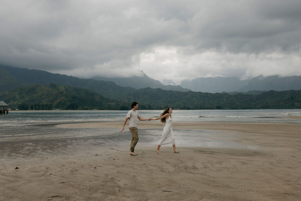 Moody beach engagement portraits in Kauai, Hawaii