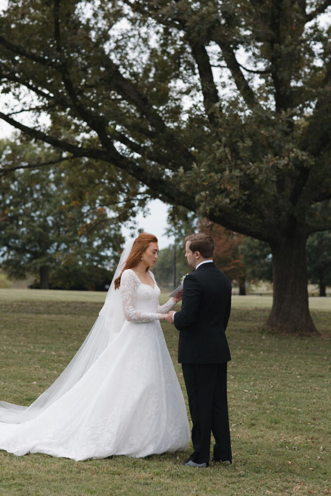 Bride and groom sharing their vows with each other.
