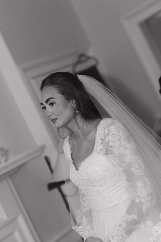 A black and white photo of the bride taking it all in.