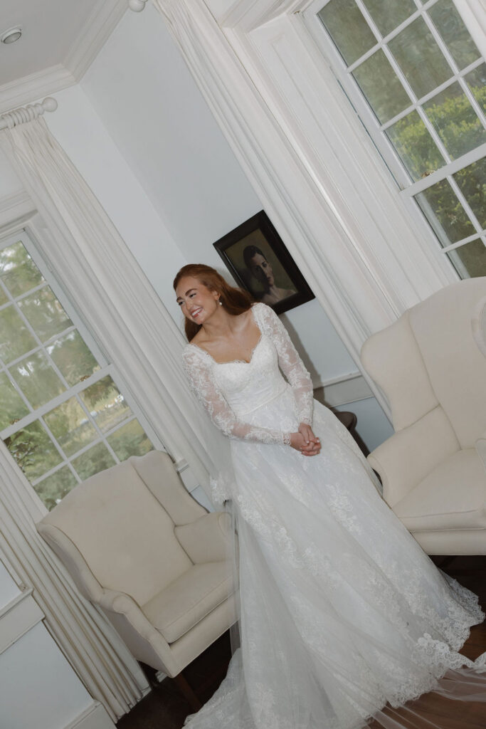 Bride smiling off to the side looking at her future husband.